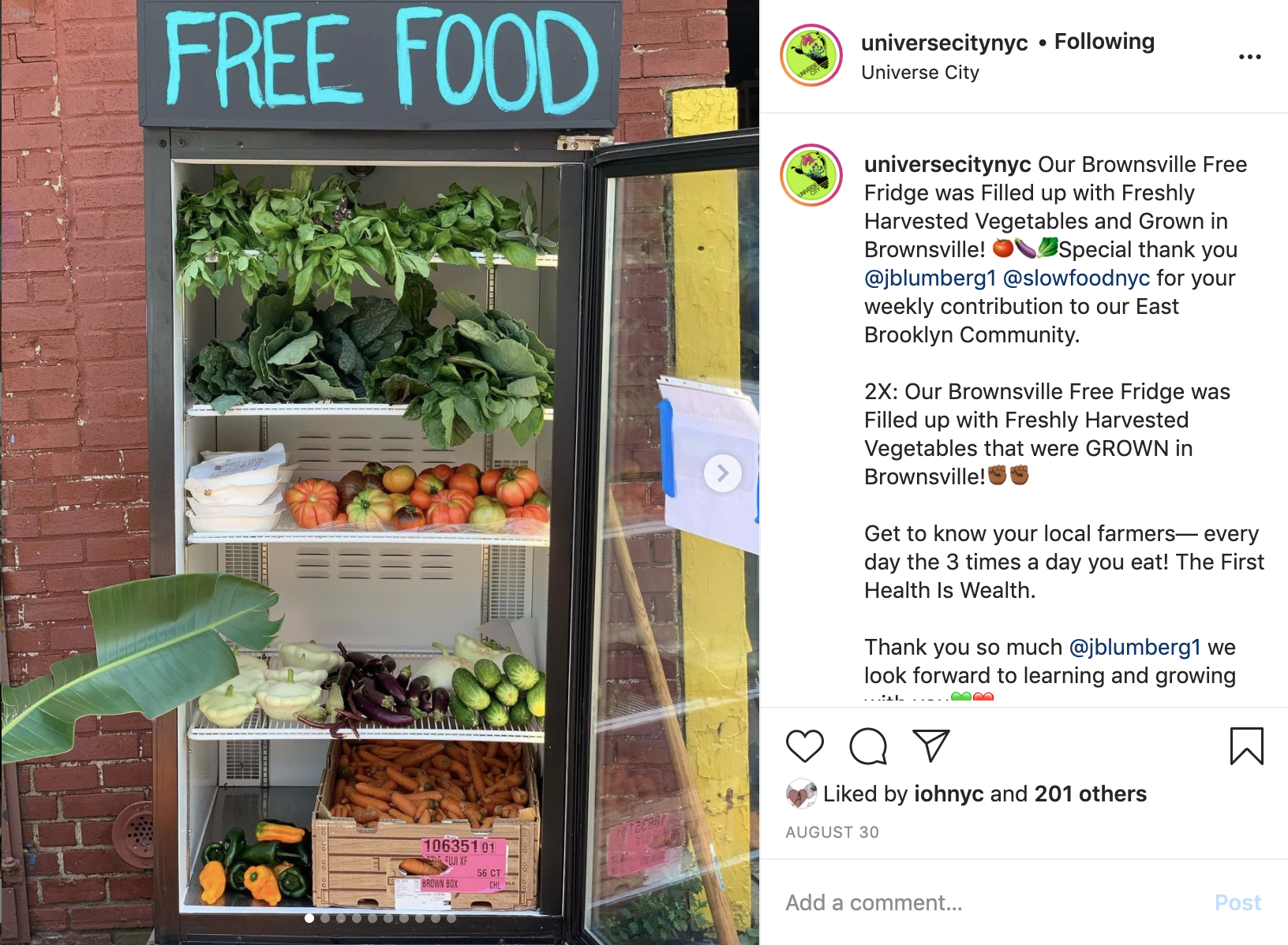 Instagram post of Brownsville Free Fridge full of vegetables with words 'FREE FOOD' painted at the top
